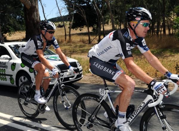 Stuart O'Grady (Saxo Bank) makes his way back to the peloton with teammate Baden Cooke