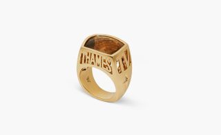 Ring made with 14ct-yellow gold, with razor blades used to laser cut the Thames logo into gold and onyx