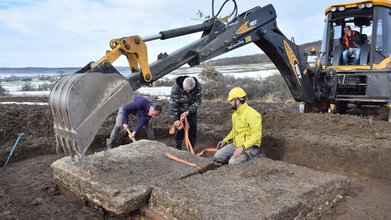 Researchers used an excavator to remove the tops of the tombs.