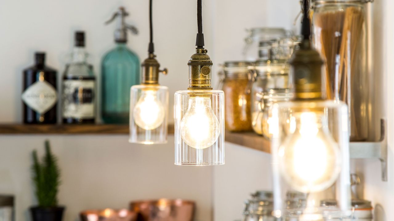 kitchen lighting with exposed bulbs and open shelving