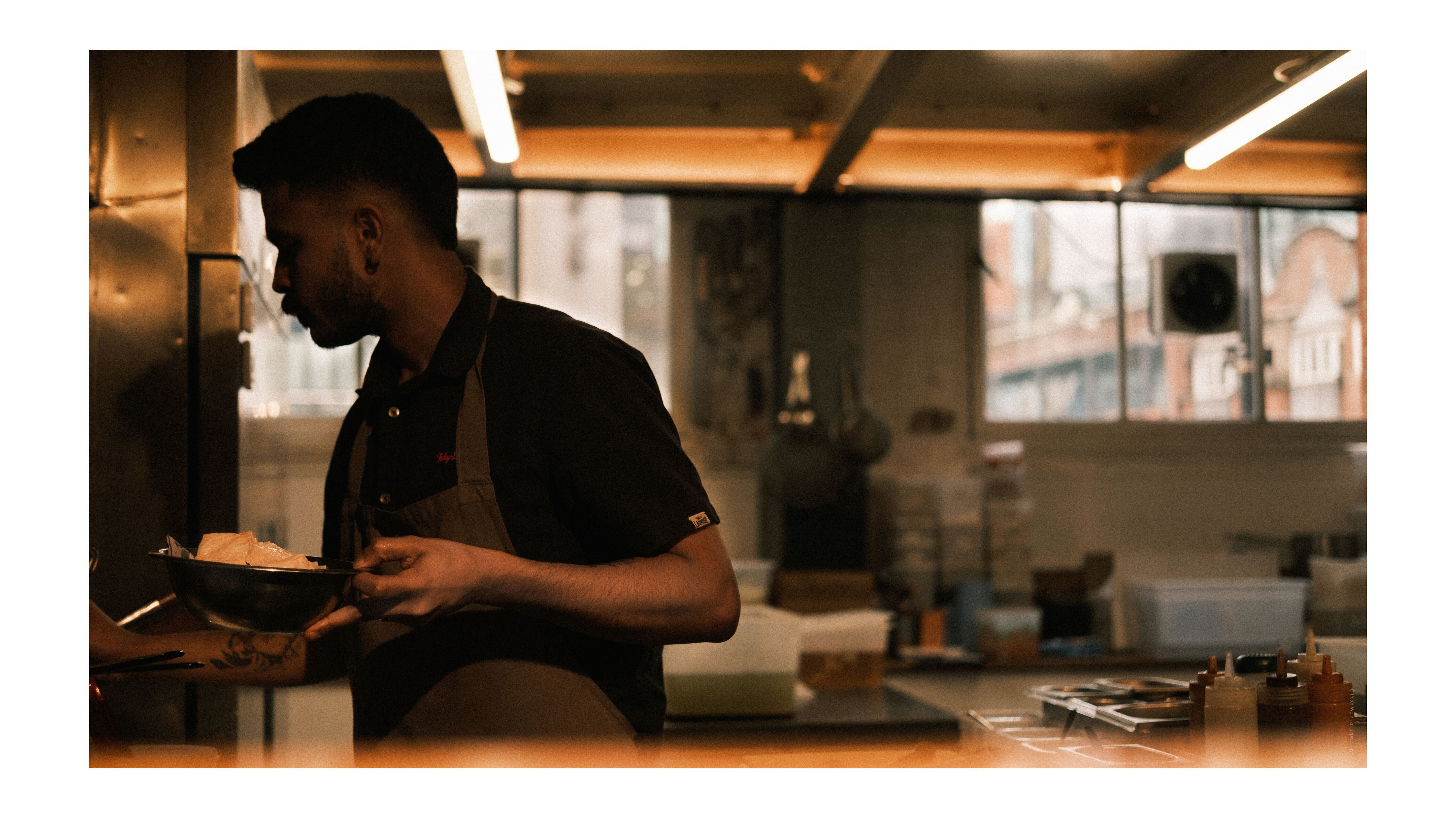 A photo of a chef cooking in a restaurant