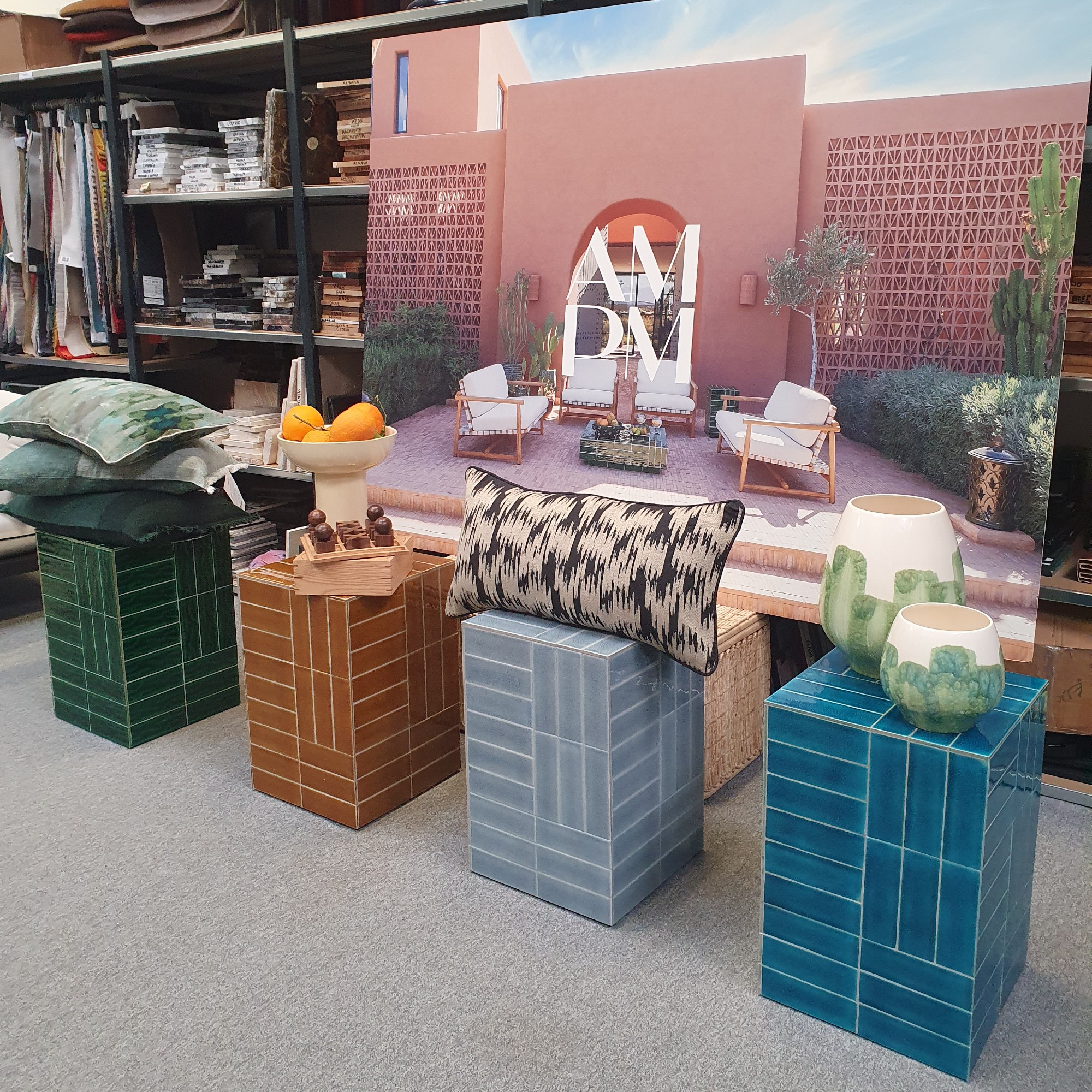 The Dendi garden side tables in four colourways displayed at La Redoute's HQ in Lille, France