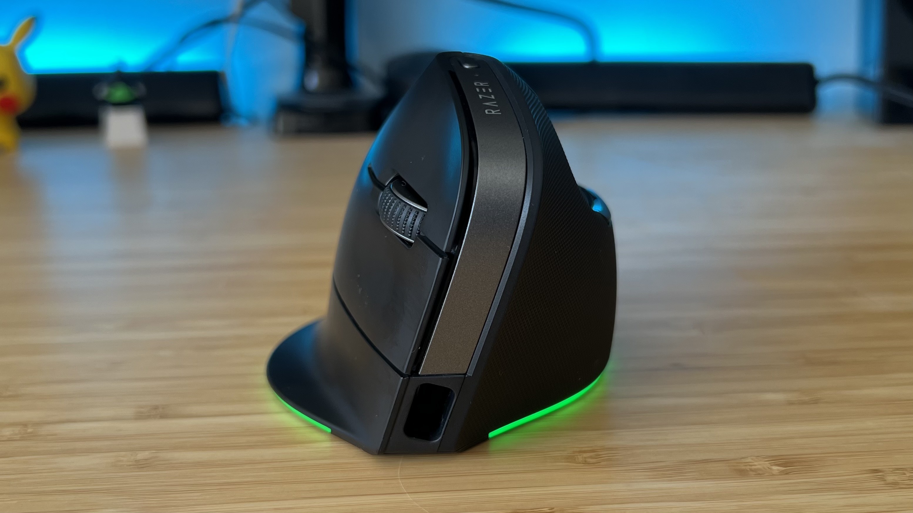 Front view of Razer Pro Click V2 Vertical Edition gaming mouse on a wooden desk
