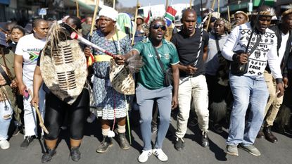 Anti-immigration protesters march against migrants in South Africa. 