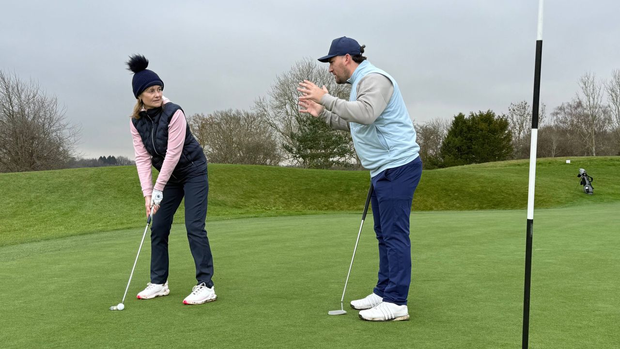 Sam De'Ath giving Alison Root advice on the green