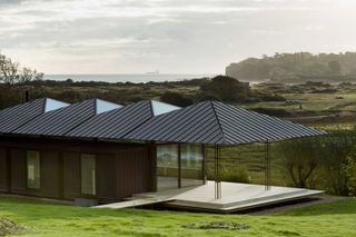 The passivhaus gives views over a sloped garden of the surrounding landscape