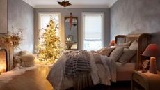 Bedroom with Christmas tree and fake snow