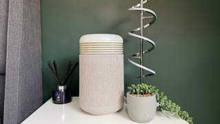 Blueair Mini Restful sunrise alarm clock and air purifier positioned on a bedside table next to home décor