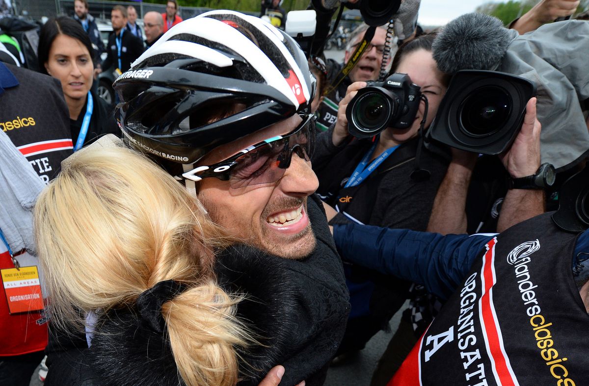 Fabian Cancellara embraces his wide after winning in 2014