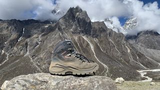 A dusty Lowa Renegade Evo GTX hiking boot in the Himalayas