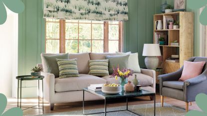 Sage green living room and beige sofa and wooden bookcase to show How to bring positive energy into your home 