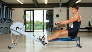 Olympic rower Pete Reed on a rowing machine