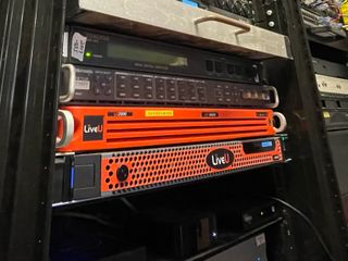 The LiveU remote production tools pictured in a cabinet in red.