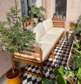 Small balcony with black and white tiles