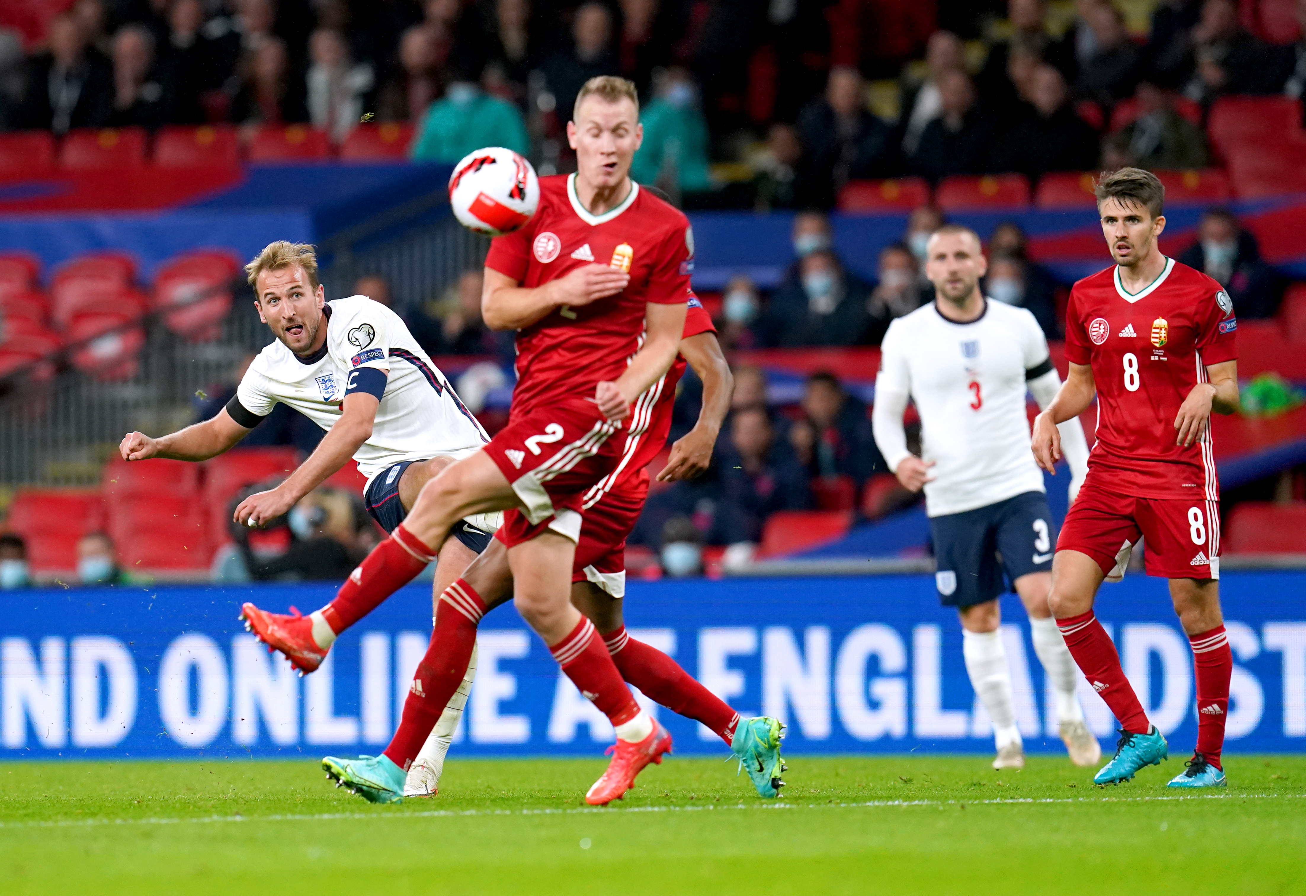 Harry Kane, left, attempts a shot on goal against Hungary