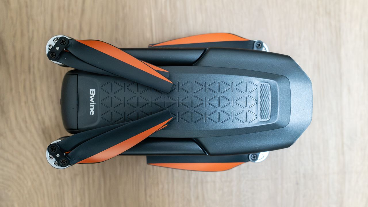 Bwine F7GIM top view folded on a wooden floor.