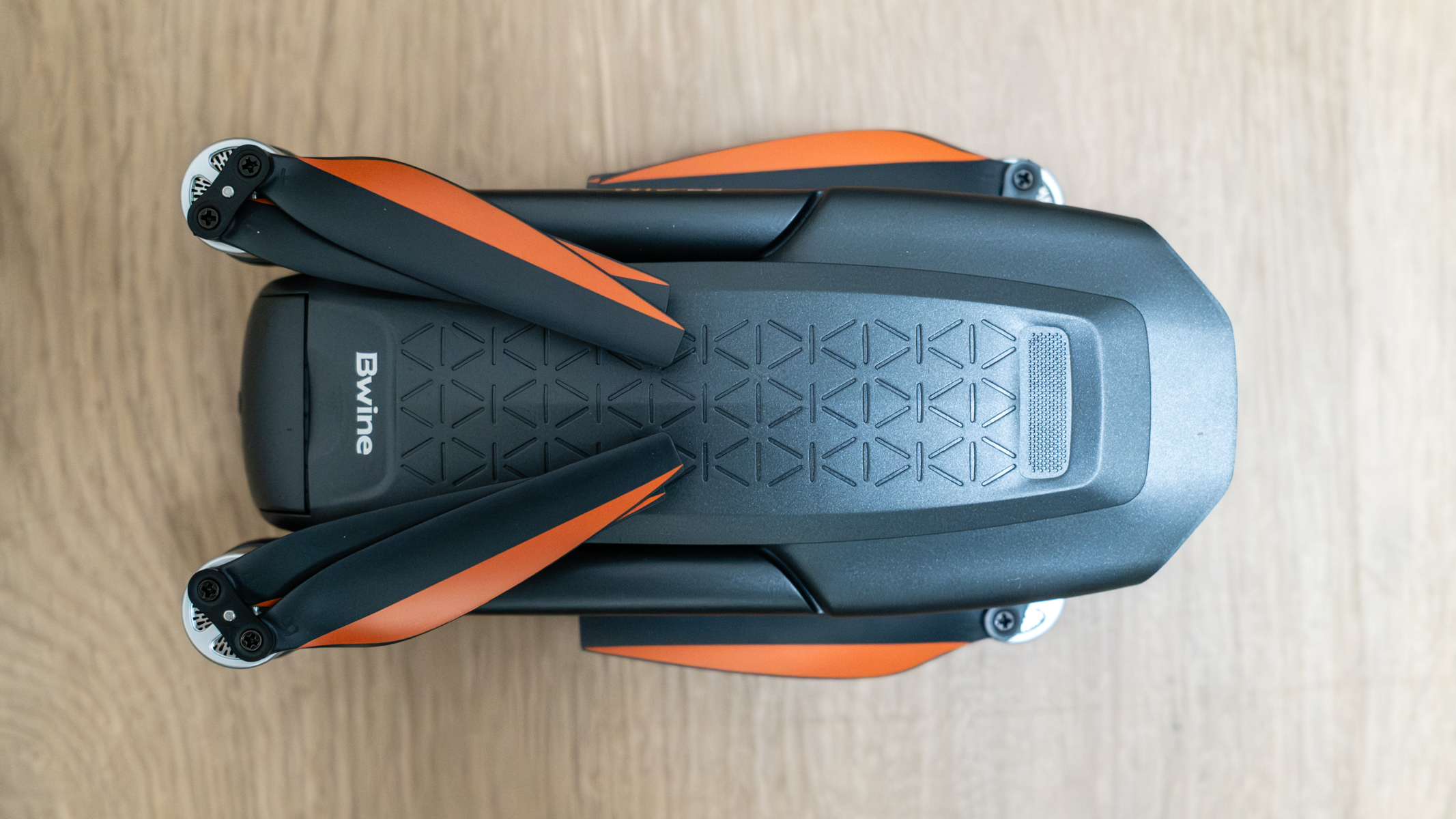 Bwine F7GIM top view folded on a wooden floor.