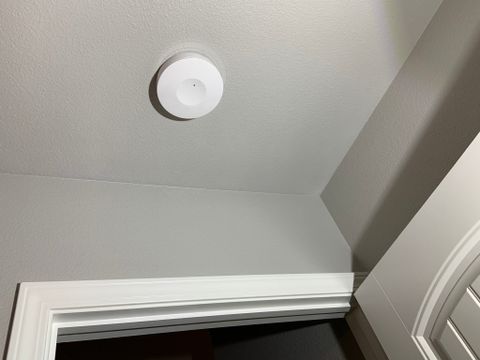 Roomme Sensor installed above a doorway