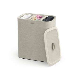 A beige fabric laundry hamper with thee compartments and a removeable lid