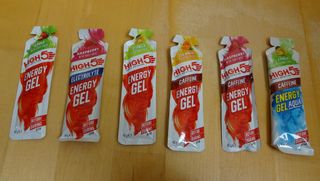 High5 Energy Gels for cycling on a wooden table