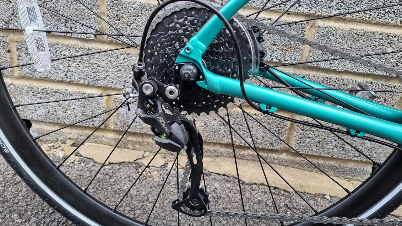 Close up of a black Shimano Alivio rear derailleur