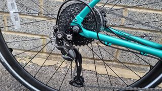 Close up of a black Shimano Alivio rear derailleur