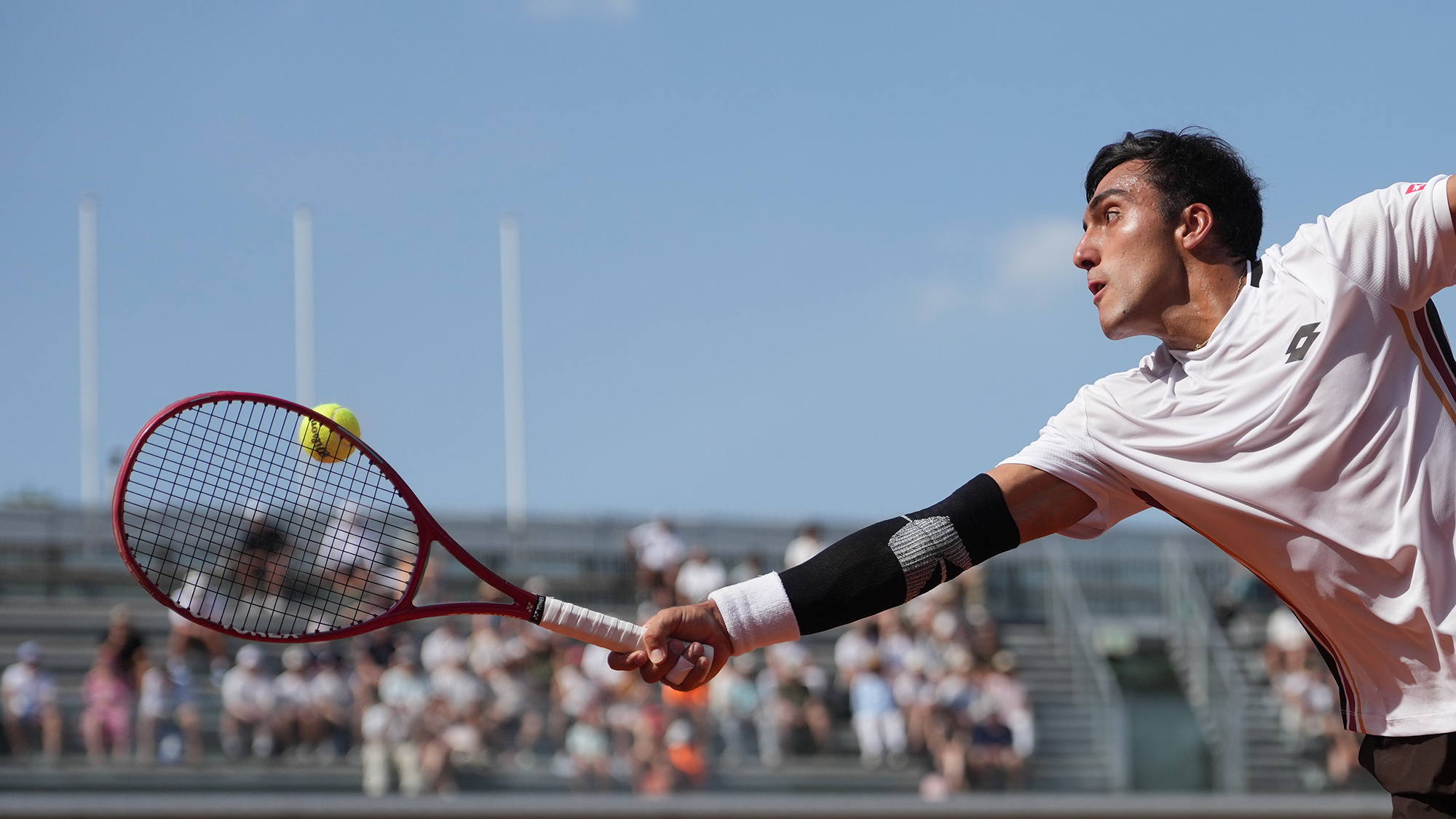 Roman Andres Burruchaga of Argentina returns to Felix Auger-Aliassime of Canada during the second round men's singles tennis match at the French Open tournament in Paris, France