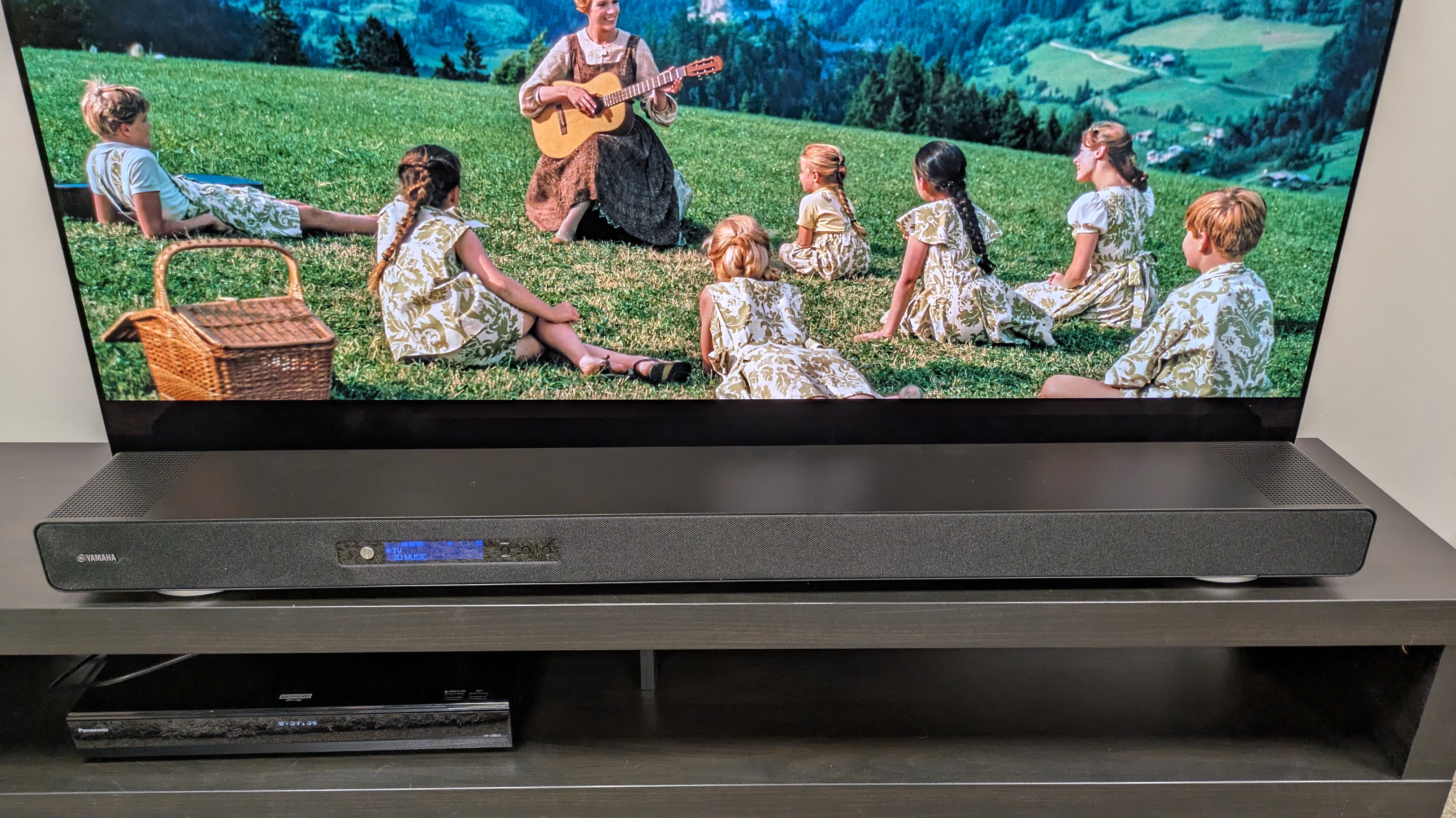 Yamaha True X Surround 90A soundbar beneath the LG G5 OLED, which is showing The Sound of Music on screen