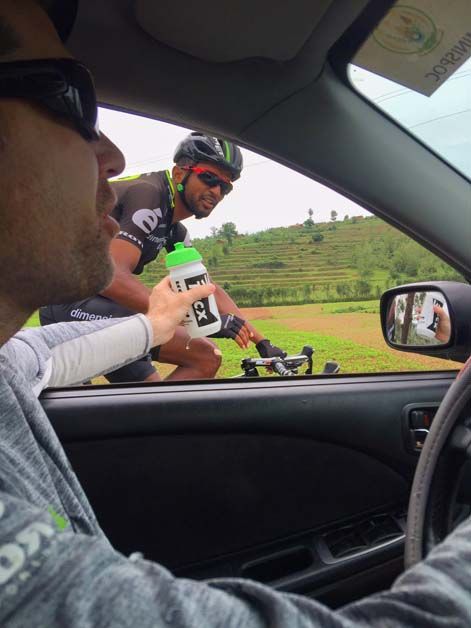 Metkel Eyob drops back to pick up some refreshments from the team car