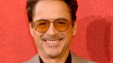 robert downey jr on a red background