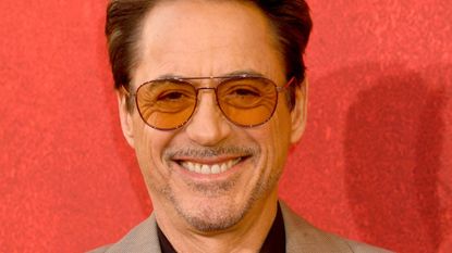 robert downey jr on a red background