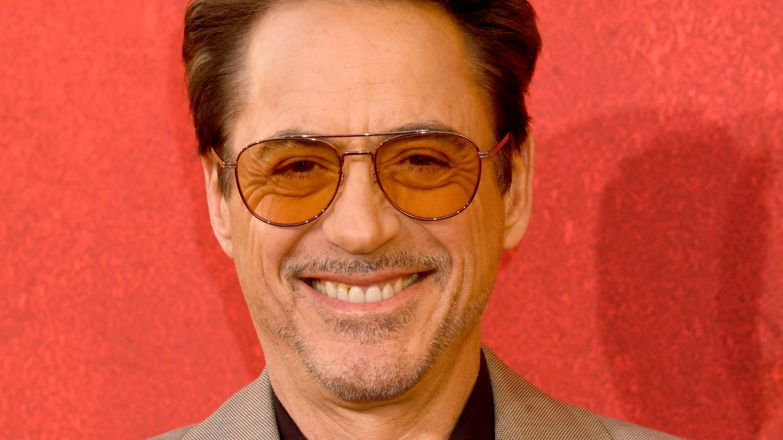 robert downey jr on a red background