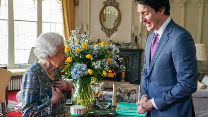 Queen tribute to Ukraine - Britain's Queen Elizabeth II (L) speaks with Canadian Prime Minister Justin Trudeau during an audience at the Windsor Castle, Berkshire, on March 7, 2022.
