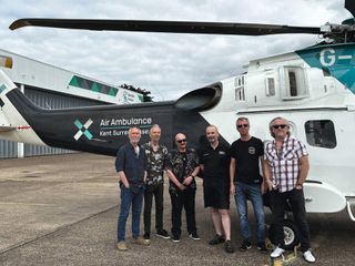 Thunder standing next to an Air Ambulance helicopter