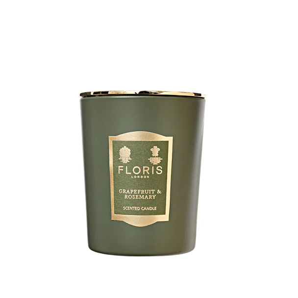 green ceramic candle on white background