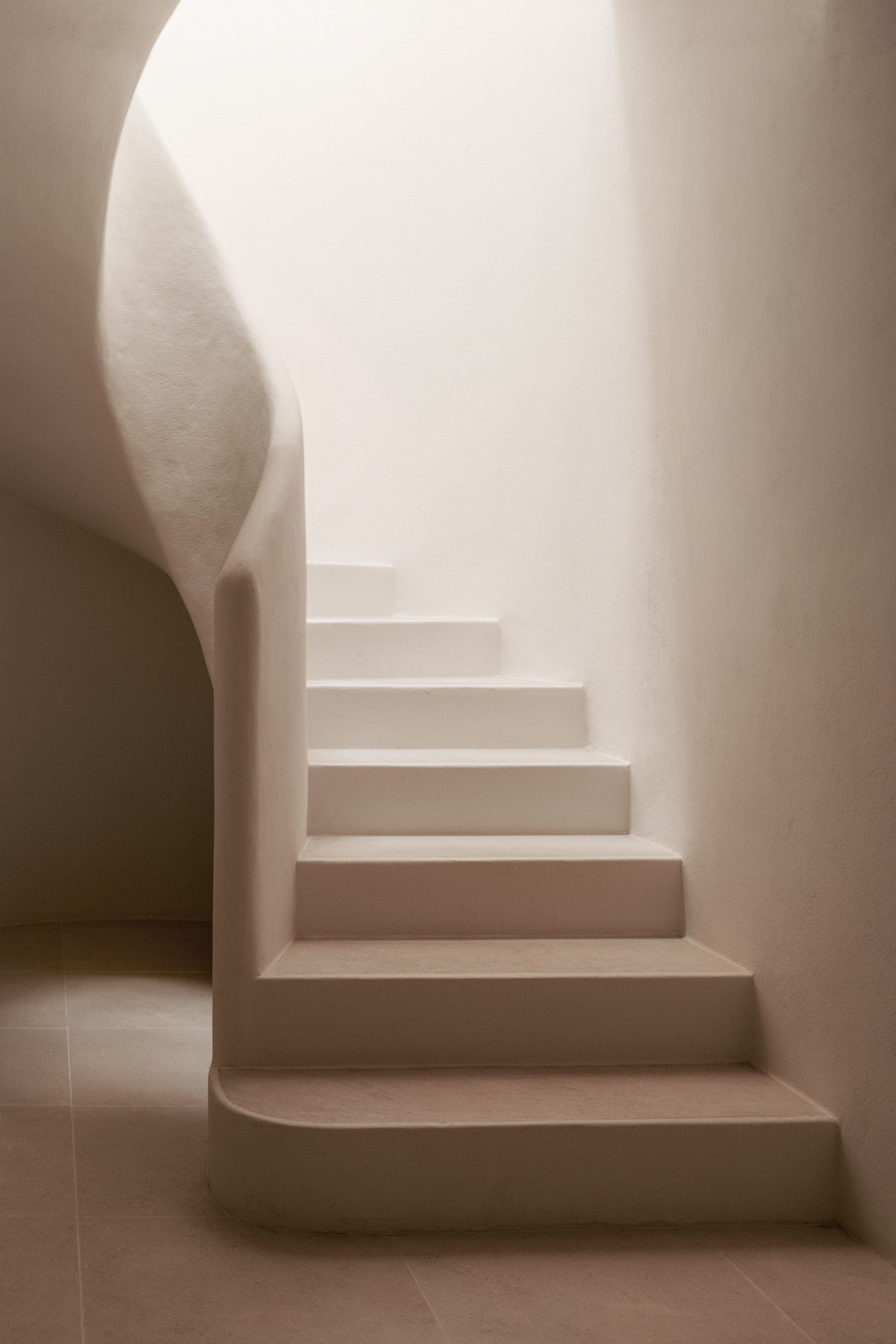 Stone staircase with curved bannister