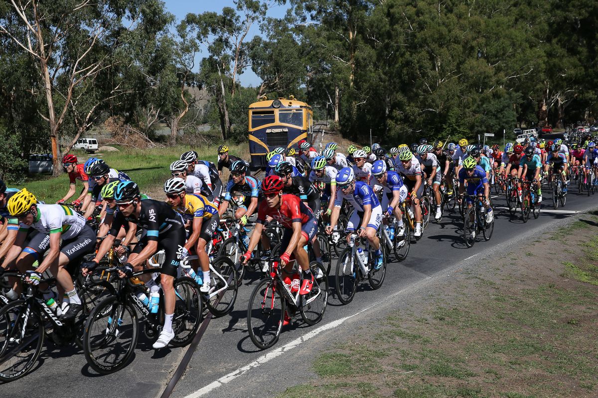 Riders cross a railway line