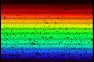 The solar spectrum -- both artificial and real -- as reconstructed by the Fourier Transform Spectrometer (FTS). The artificial part is that the FTS does not spread white light into the rainbow, but measures intensities. The real aspect is that this depicts these intensities as colors and shows the absorption lines -- fingerprints of atoms in the solar atmosphere -- that are too narrow for the human eye to perceive.