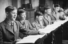 May 1953: The choirboys of Westminster Abbey rehearsing for the forthcoming coronation service of Queen Elizabeth II. (Photo by Bert Hardy/Picture Post/Getty Images)