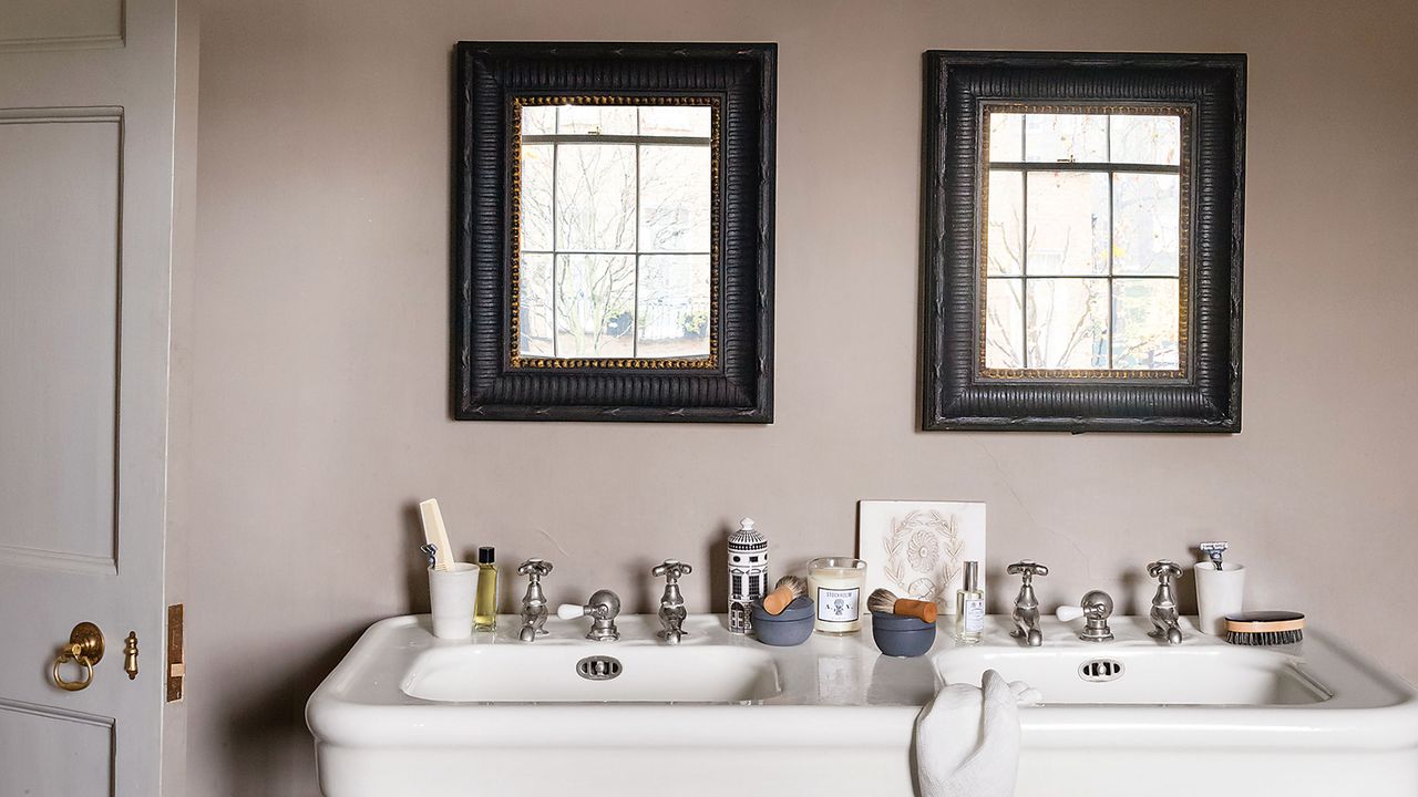 Pale brown bathroom with with wooden mirrors