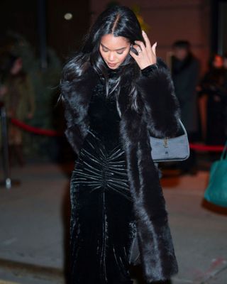 Laura Harrier wears Saint Laurent's 'Le 5 à 7' bag February 05, 2025 in New York City.