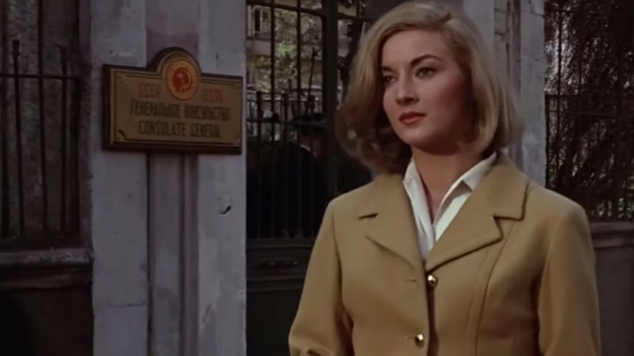 Daniela Bianchi standing in front a gate in From Russia With Love