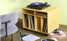 Montana Spin vinyl storage cabinet in yellow, with record player on top 