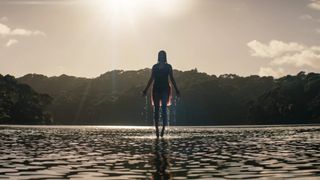 A woman floating above a lake in "Evil Dead Rise" (2023)