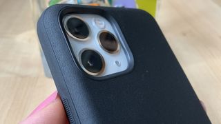 Close up of iPhone 13 in a blue case