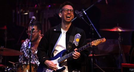 Cory Wong plays a blue Stratocaster during a 2025 performance at Koerner Hall, Ontario.