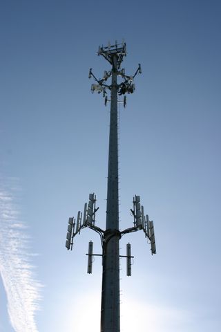 This tower rises above the hills in Hillsboro, OR. High above the ground, Clearwire has multiple WiMAX and system relay antennas mounted on someone else’s cellular tower.