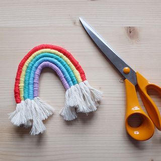 rainbow macrame bunting decoration with scissors