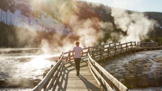 Hiker on boardwalk at Yellowstone National Park