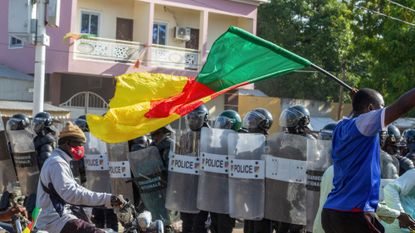 Protesters clash with police in Garoua, Cameroon, following the presidential election.
